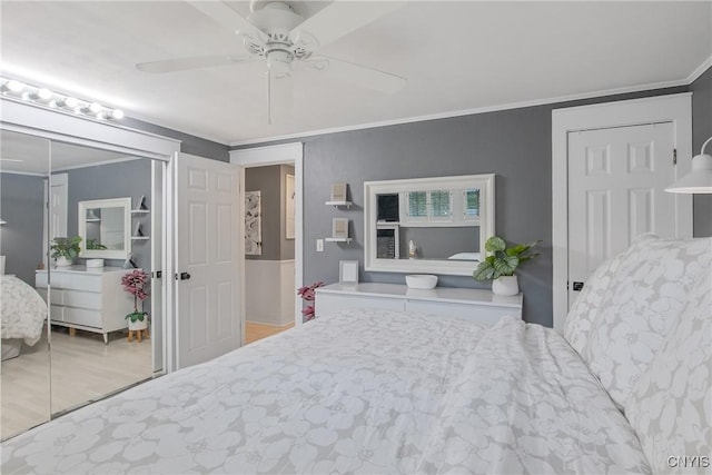 207 Baxton St, Clay, NY 13212 - bedroom featuring crown molding, wood finished floors, a ceiling fan, and a closet