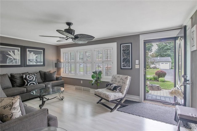 207 Baxton St, Clay, NY 13212 - living area with a ceiling fan, wood finished floors, crown molding, and healthy amount of natural light