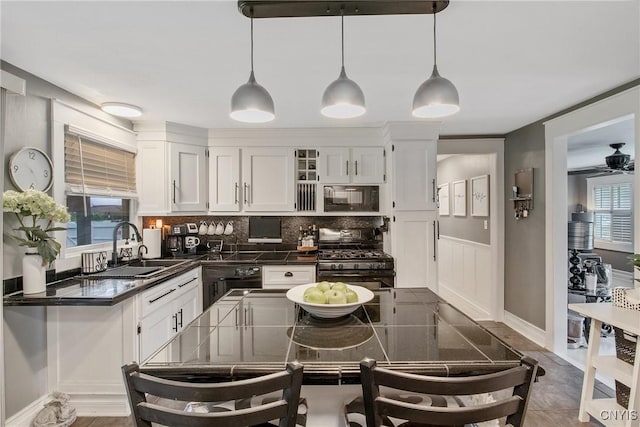 207 Baxton St, Clay, NY 13212 - kitchen with black appliances, dark countertops, and white cabinets