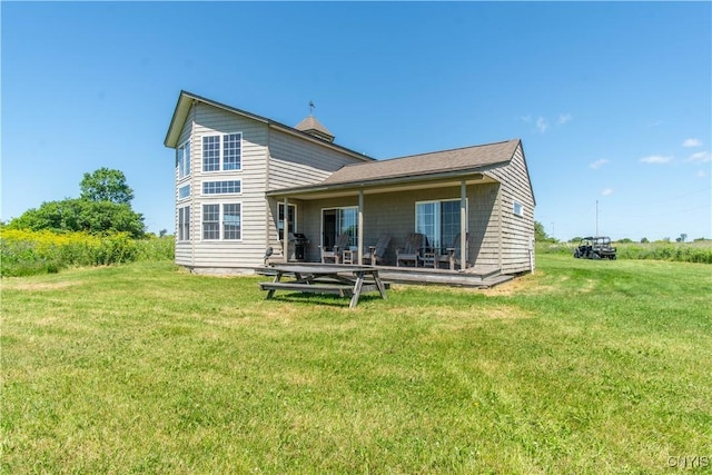 1812 Grenadier Island Rd Unit 1, Cape Vincent, NY 13618 - rear view of property with a lawn