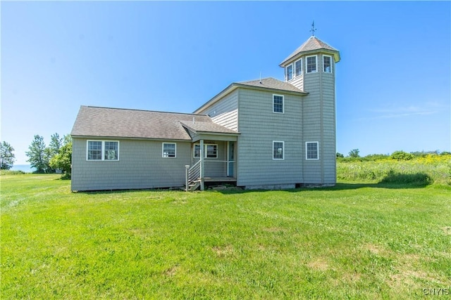 1812 Grenadier Island Rd Unit 1, Cape Vincent, NY 13618 - back of property featuring a yard and roof with shingles