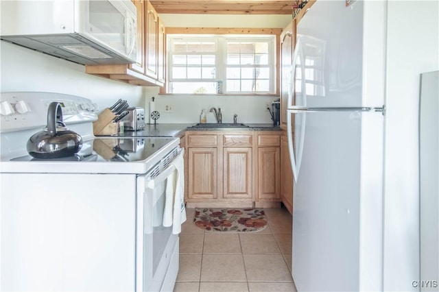 1812 Grenadier Island Rd Unit 1, Cape Vincent, NY 13618 - kitchen with white appliances, light tile patterned floors, and light brown cabinets