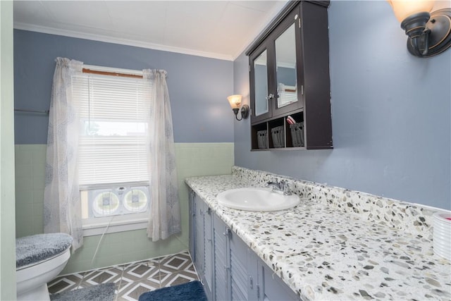 82 Maple St, Canisteo, NY 14823 - bathroom with vanity, tile walls, ornamental molding, and wainscoting
