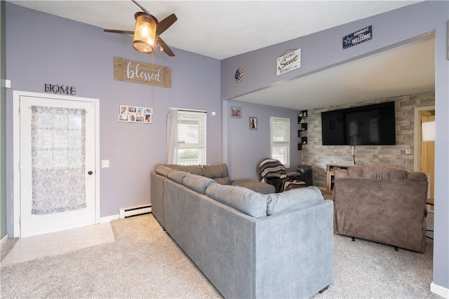 82 Maple St, Canisteo, NY 14823 - living room with baseboard heating, a ceiling fan, and light carpet