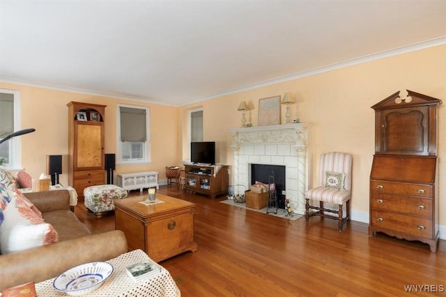 83 Bryant # 7Ab, Buffalo, NY 14209 - living room featuring crown molding, wood finished floors, and a tiled fireplace