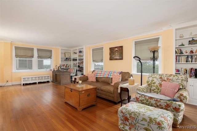 83 Bryant # 7Ab, Buffalo, NY 14209 - living room featuring radiator, built in features, wood finished floors, and ornamental molding