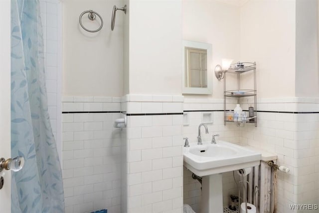 83 Bryant # 7Ab, Buffalo, NY 14209 - bathroom with a wainscoted wall, tile walls, and curtained shower