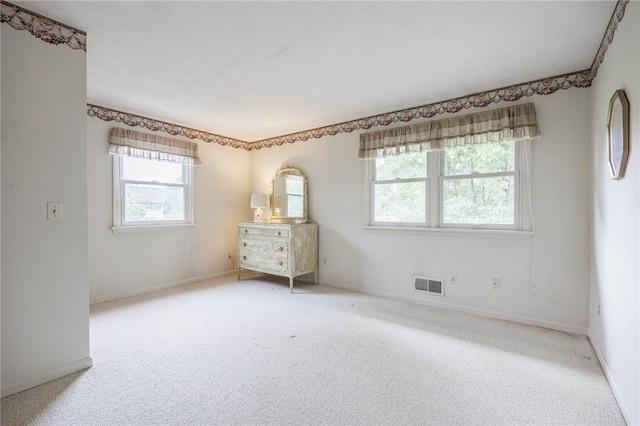 668 Willow Ln, Webster, NY 14580 - carpeted empty room with healthy amount of natural light