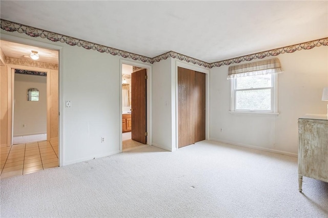 668 Willow Ln, Webster, NY 14580 - unfurnished bedroom with light carpet, multiple windows, a closet, and connected bathroom