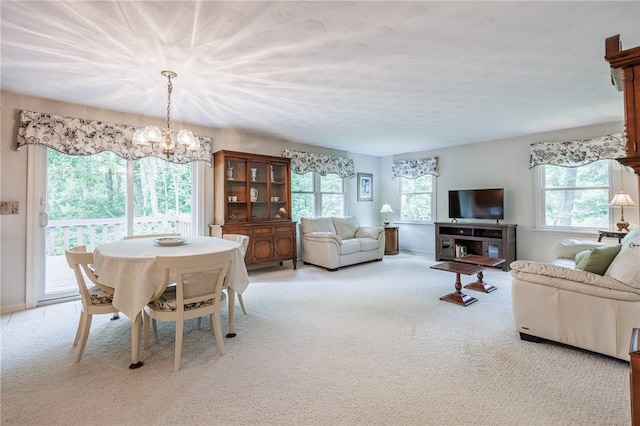 668 Willow Ln, Webster, NY 14580 - carpeted dining space featuring a chandelier