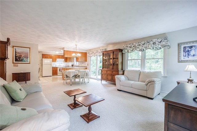 668 Willow Ln, Webster, NY 14580 - living room with a chandelier and light carpet