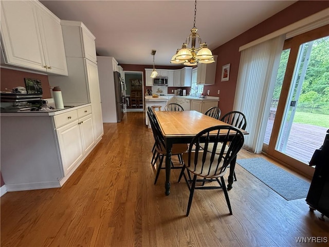26 Forestglen Cir, Amherst, NY 14221 - dining room featuring wood finished floors and a chandelier