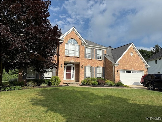 26 Forestglen Cir, Amherst, NY 14221 - view of front of property featuring brick siding, a front yard, a garage, and driveway