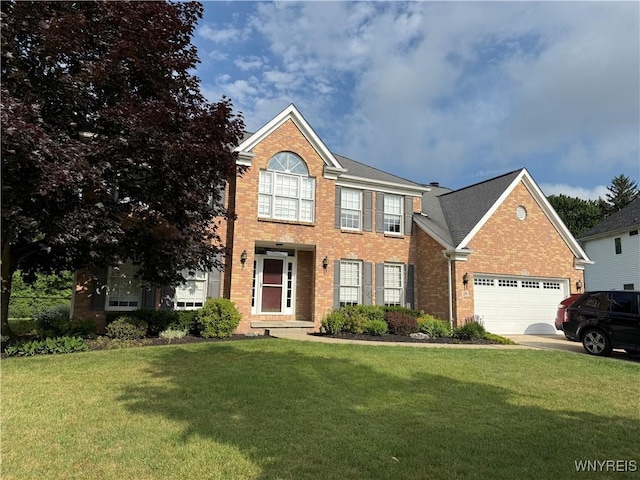 26 Forestglen Cir, Amherst, NY 14221 - view of front of house featuring brick siding, a front yard, an attached garage, and concrete driveway