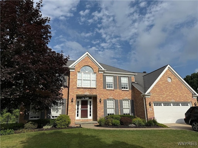 26 Forestglen Cir, Amherst, NY 14221 - view of front of property with brick siding, an attached garage, a front lawn, and concrete driveway