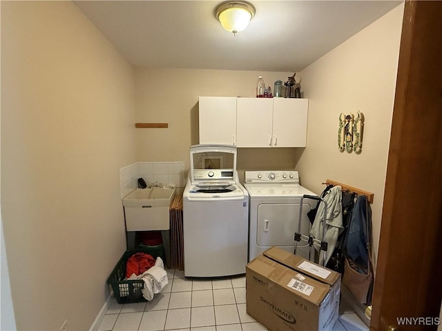 26 Forestglen Cir, Amherst, NY 14221 - laundry area featuring cabinet space, washing machine and clothes dryer, and light tile patterned floors