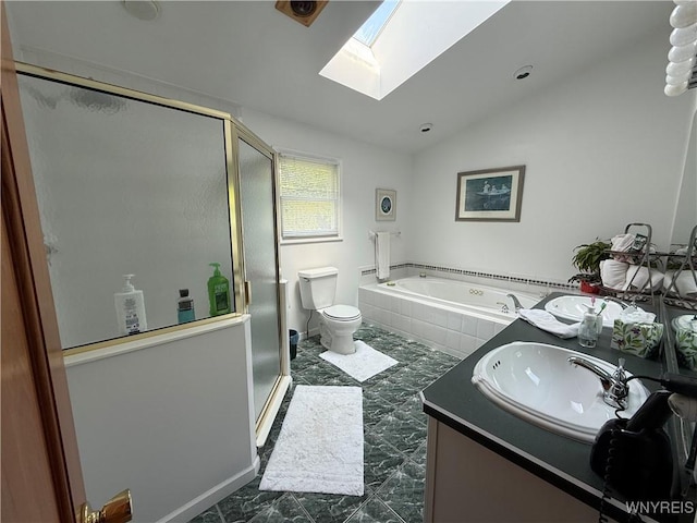 26 Forestglen Cir, Amherst, NY 14221 - bathroom with marble look tile flooring, a skylight, a stall shower, lofted ceiling, and a garden tub