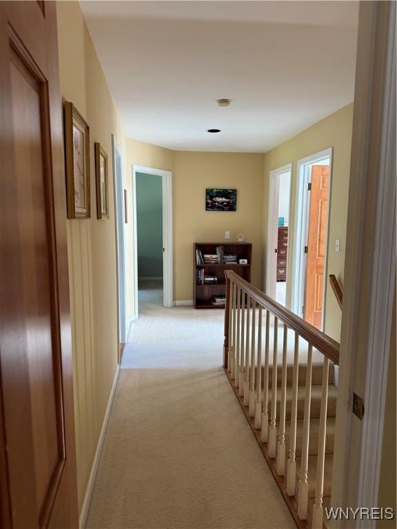 26 Forestglen Cir, Amherst, NY 14221 - hallway featuring light carpet and an upstairs landing