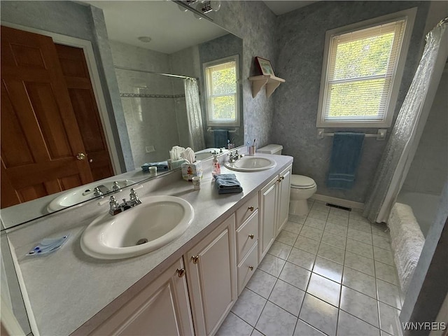 26 Forestglen Cir, Amherst, NY 14221 - bathroom with double vanity, tile patterned floors, and shower / bath combo