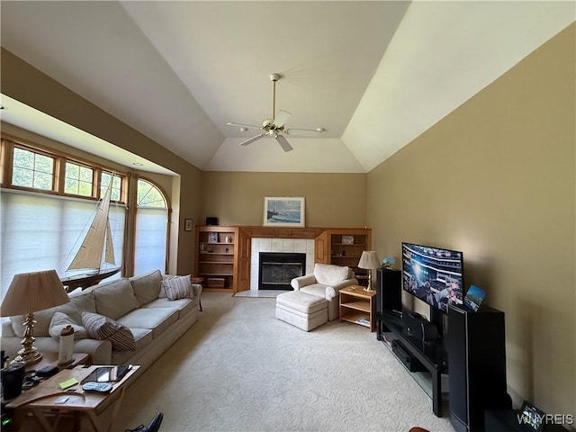 26 Forestglen Cir, Amherst, NY 14221 - carpeted living room featuring ceiling fan, a tiled fireplace, and lofted ceiling