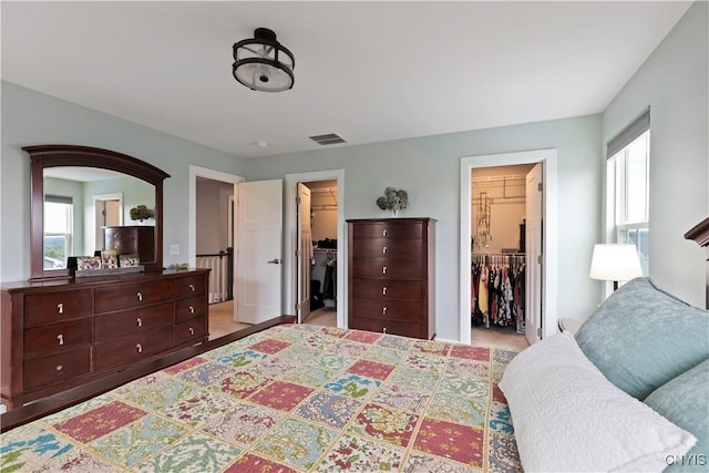 2600 Sunshine Cir, Camillus, NY 13031 - bedroom featuring a walk in closet and carpet floors