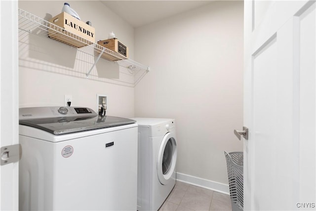 2600 Sunshine Cir, Camillus, NY 13031 - laundry room with washer and clothes dryer and light tile patterned floors