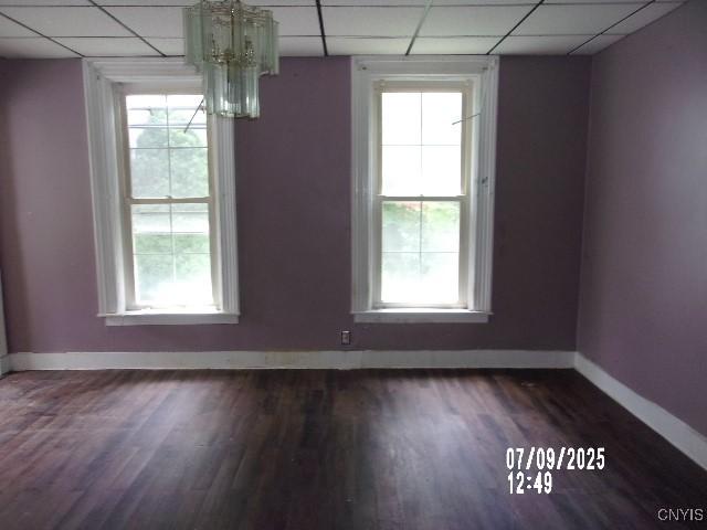 20 N 4th Ave, German Flatts, NY 13357 - unfurnished dining area featuring a drop ceiling, dark wood-style floors, healthy amount of natural light, and a chandelier