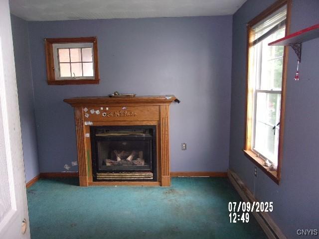20 N 4th Ave, German Flatts, NY 13357 - unfurnished living room featuring a fireplace and carpet