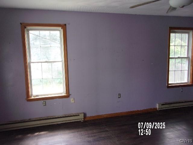 20 N 4th Ave, German Flatts, NY 13357 - spare room with a baseboard radiator, wood finished floors, and a ceiling fan