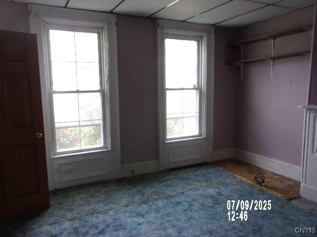20 N 4th Ave, German Flatts, NY 13357 - unfurnished room with plenty of natural light, carpet flooring, and a paneled ceiling