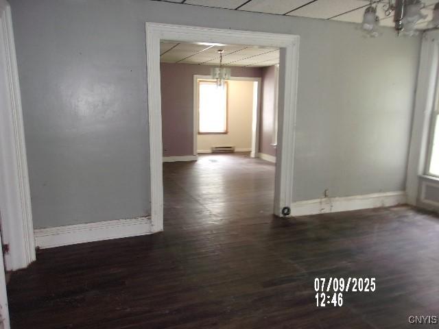 20 N 4th Ave, German Flatts, NY 13357 - spare room featuring a chandelier, dark wood-type flooring, and healthy amount of natural light