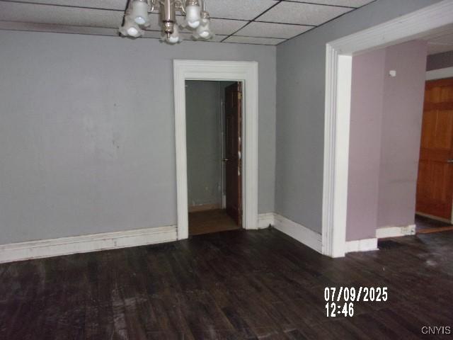 20 N 4th Ave, German Flatts, NY 13357 - unfurnished dining area with a chandelier, wood finished floors, and a paneled ceiling