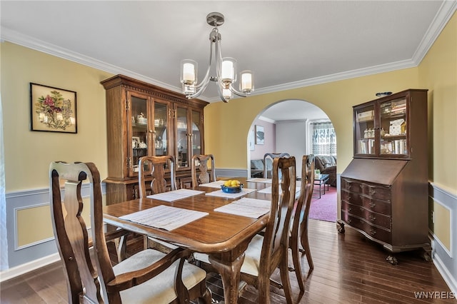 112 Creekview Dr, West Seneca, NY 14224 - dining room with arched walkways, a chandelier, ornamental molding, wainscoting, and dark wood finished floors