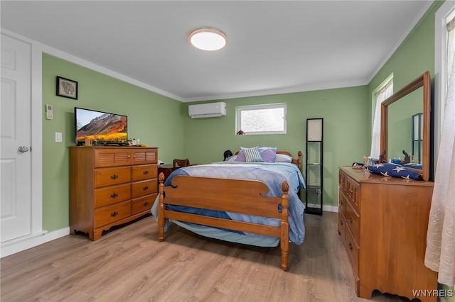 112 Creekview Dr, West Seneca, NY 14224 - bedroom with a wall unit AC, light wood finished floors, and ornamental molding