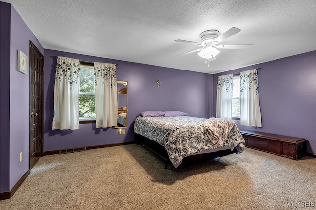 112 Creekview Dr, West Seneca, NY 14224 - bedroom with carpet floors, multiple windows, a textured ceiling, and ceiling fan
