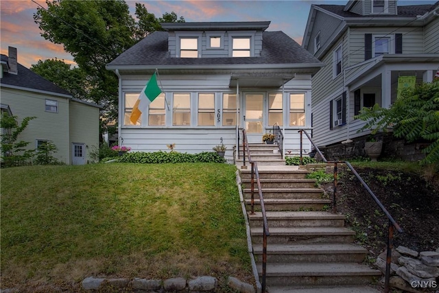 505 Tompkins St, Syracuse, NY 13204 - bungalow-style house featuring a lawn and a shingled roof