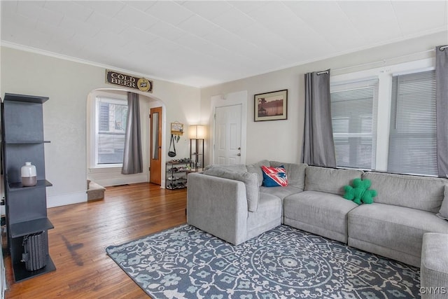 505 Tompkins St, Syracuse, NY 13204 - living area featuring arched walkways, wood finished floors, and ornamental molding