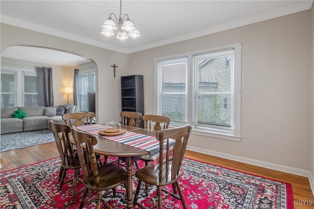 505 Tompkins St, Syracuse, NY 13204 - dining room with arched walkways, plenty of natural light, and a chandelier