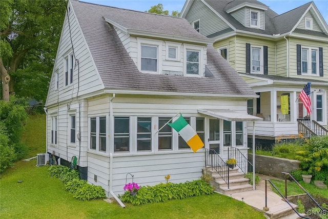 505 Tompkins St, Syracuse, NY 13204 - view of front facade with entry steps, a front lawn, and a shingled roof
