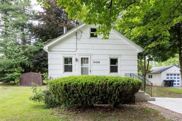 5156 Fairgrounds Rd, Hamburg, NY 14075 - bungalow-style house with an outbuilding and a front lawn