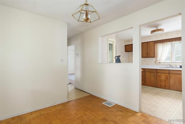 5156 Fairgrounds Rd, Hamburg, NY 14075 - unfurnished dining area featuring a sink and baseboards