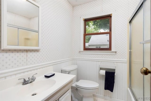 5156 Fairgrounds Rd, Hamburg, NY 14075 - full bath featuring wallpapered walls, wainscoting, vanity, and combined bath / shower with glass door