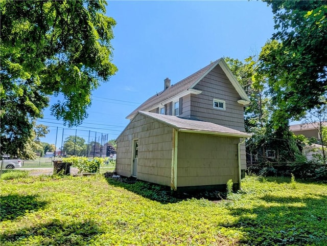 883 Brown Rd, Irondequoit, NY 14622 - view of side of property featuring a chimney and an outdoor structure