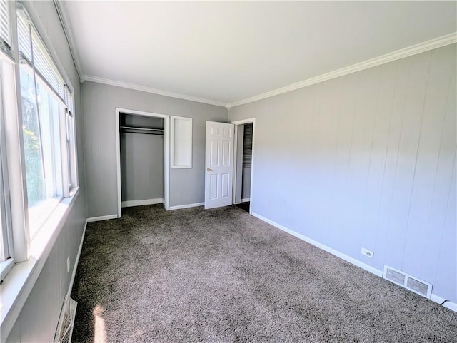 883 Brown Rd, Irondequoit, NY 14622 - unfurnished bedroom featuring carpet, crown molding, and a closet