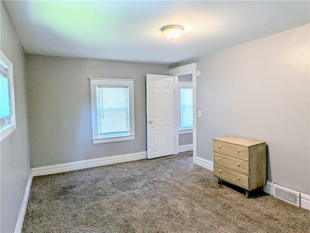 883 Brown Rd, Irondequoit, NY 14622 - unfurnished bedroom featuring carpet flooring and baseboards