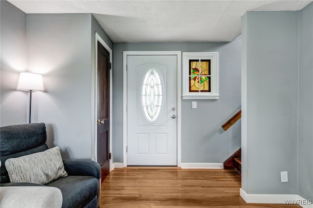 445 75th St, Niagara Falls, NY 14304 - entryway with wood finished floors and a textured ceiling