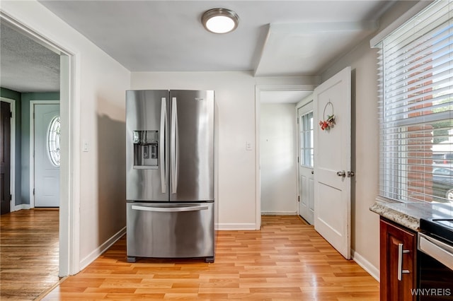 445 75th St, Niagara Falls, NY 14304 - kitchen featuring stainless steel appliances, light wood finished floors, and plenty of natural light