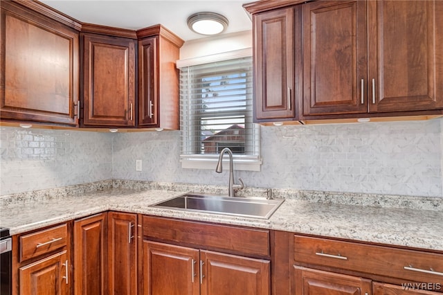 445 75th St, Niagara Falls, NY 14304 - kitchen featuring decorative backsplash, brown cabinetry, and light stone countertops