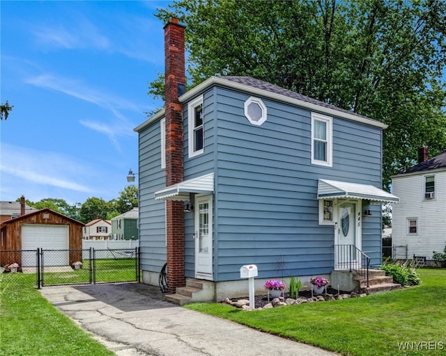 445 75th St, Niagara Falls, NY 14304 - view of front of home featuring a chimney, a detached garage, driveway, a gate, and entry steps