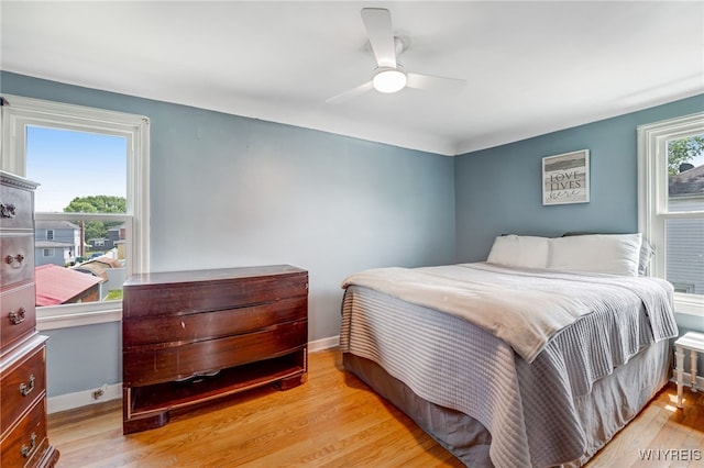 445 75th St, Niagara Falls, NY 14304 - bedroom with wood finished floors and ceiling fan